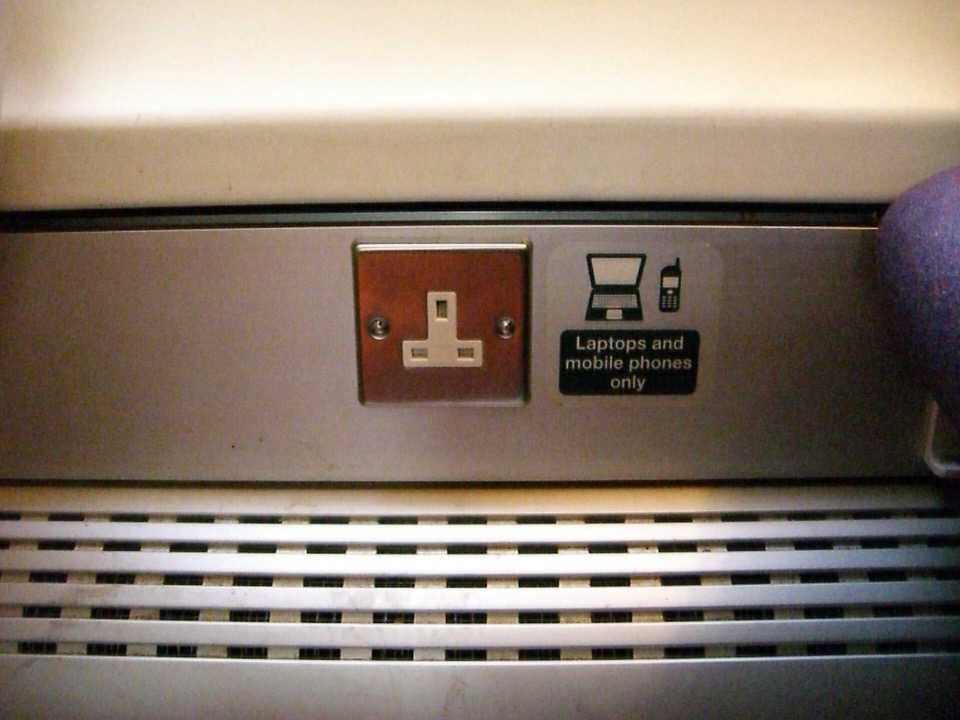 A BS 1363 socket with its screw fixings visible